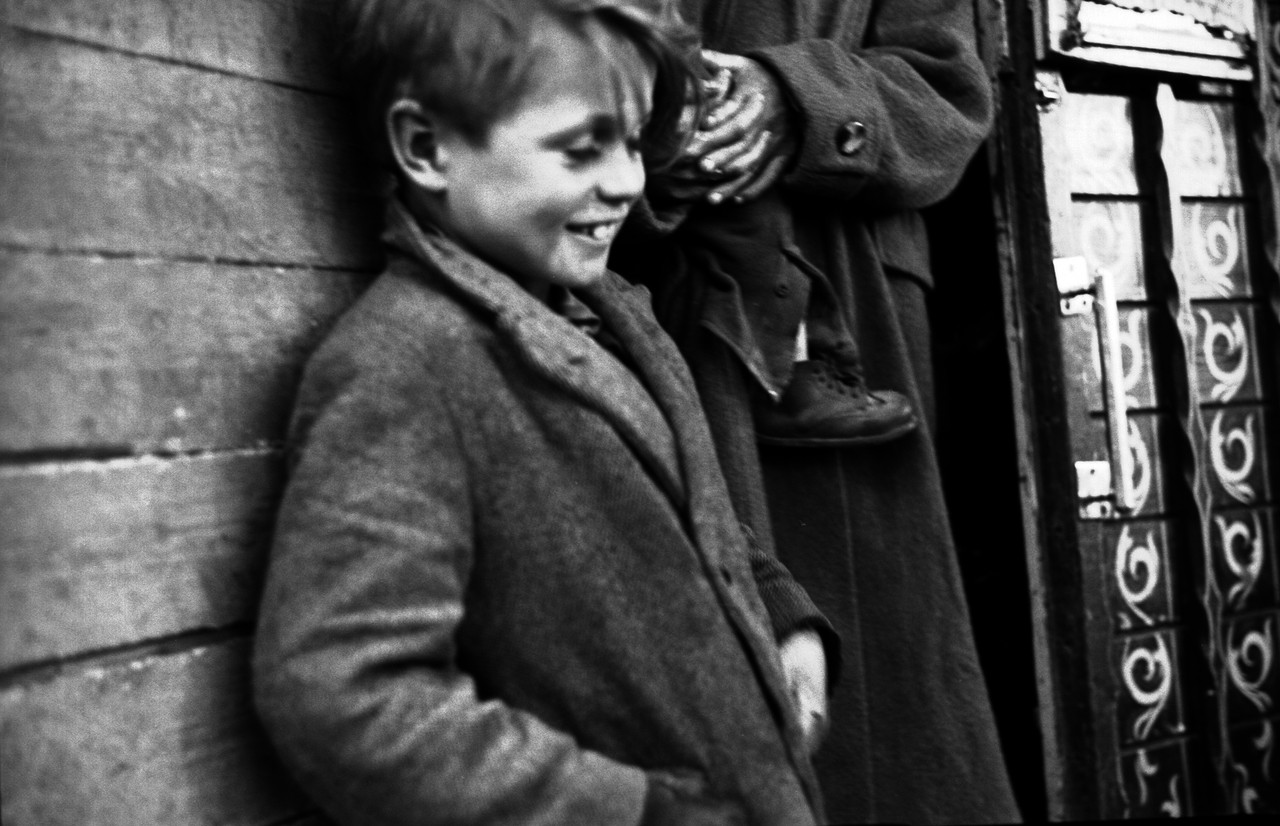 [Little boy traveller beside adult, Co. Galway.] - UCD Digital Library