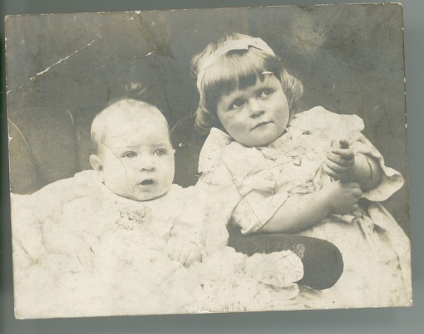 Photograph of Eibhlín MacNeill (later Tierney) as a young child, with a ...