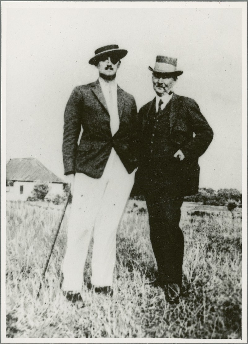 Photograph of James Joyce with another man, standing in a field, with a ...