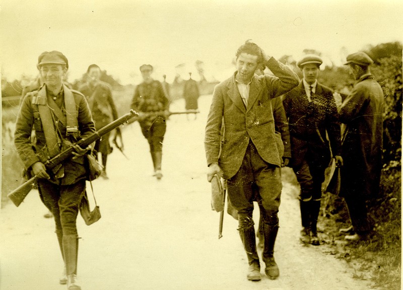 Free State Army soldiers walking along a country road with guns - UCD ...